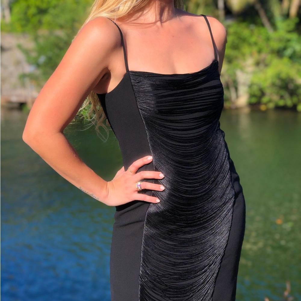 Calvin Klein black dress with fringe detailing.

Condition: Excellent.